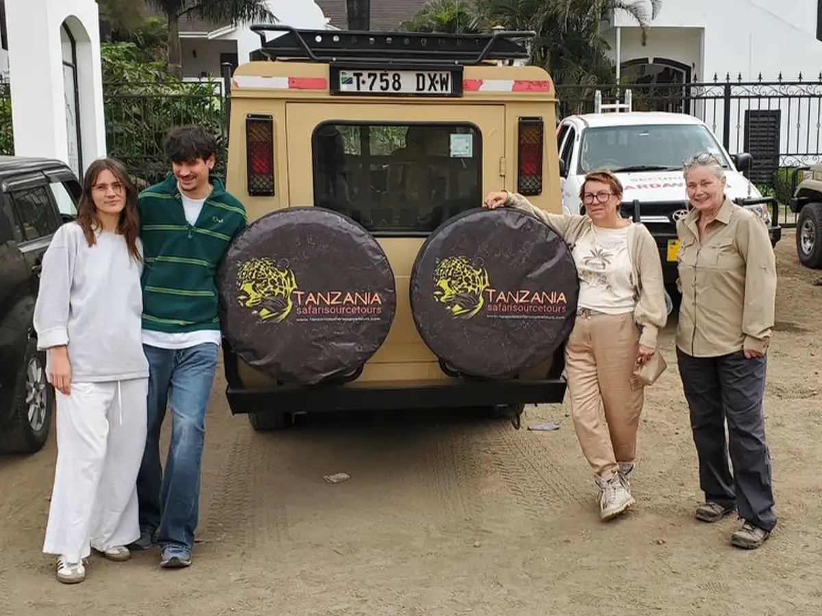 Family walking along the beach after a northern circuit safari