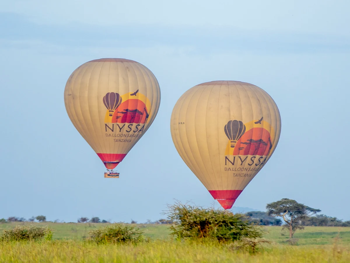 Couple taking a hot air balloon ride during a 14 day honeymoon safari