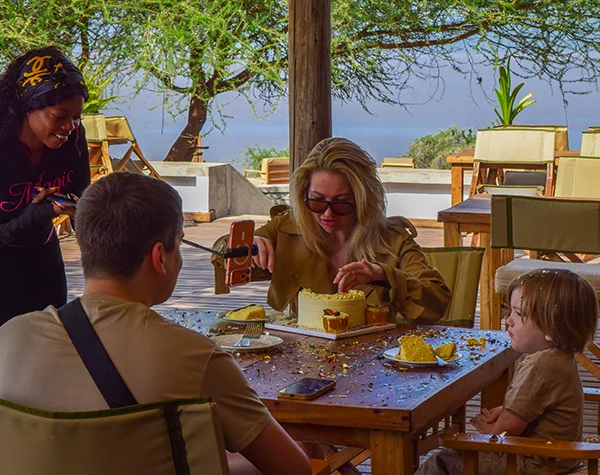 Safari guide teaching children about wildlife in Tanzania